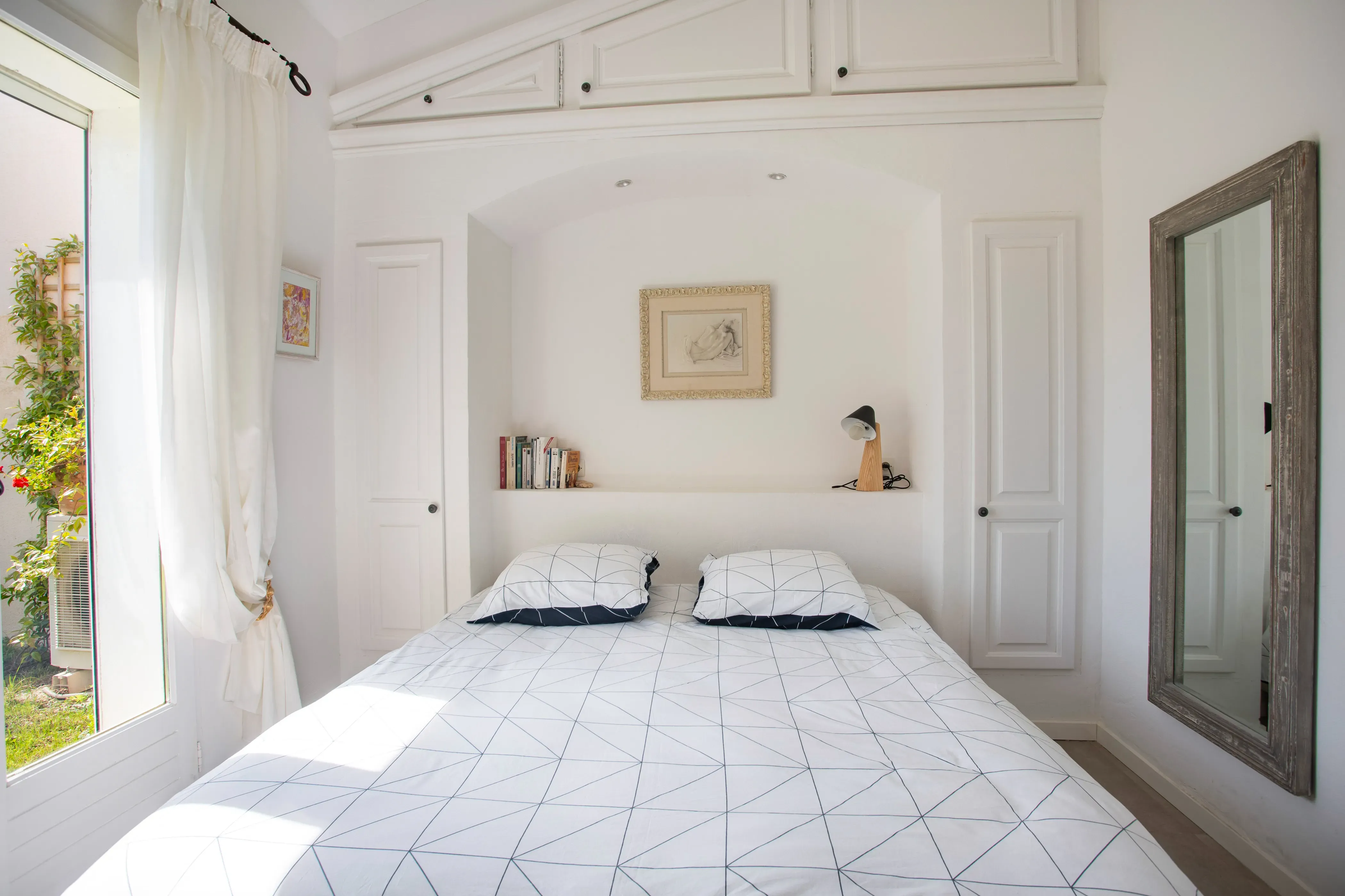 Bright bedroom with premium bedding