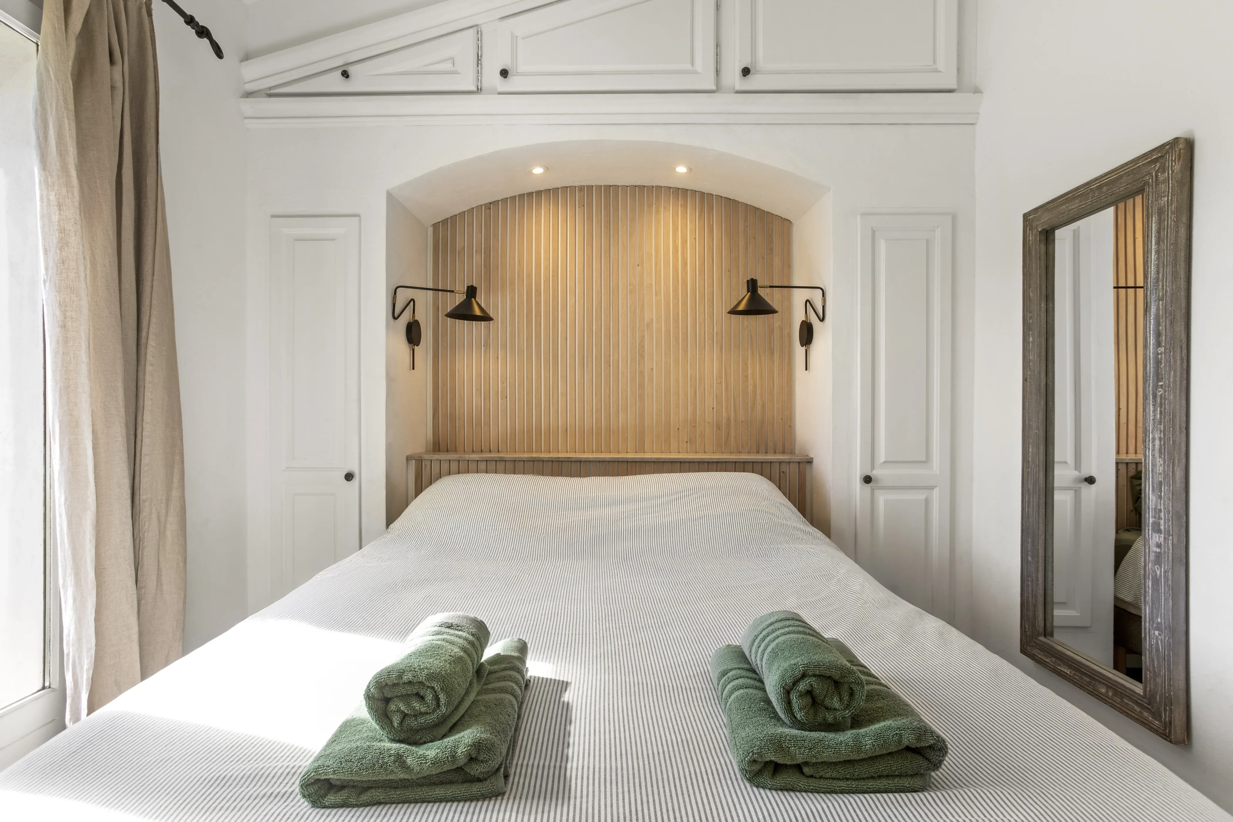 Bright bedroom with premium bedding