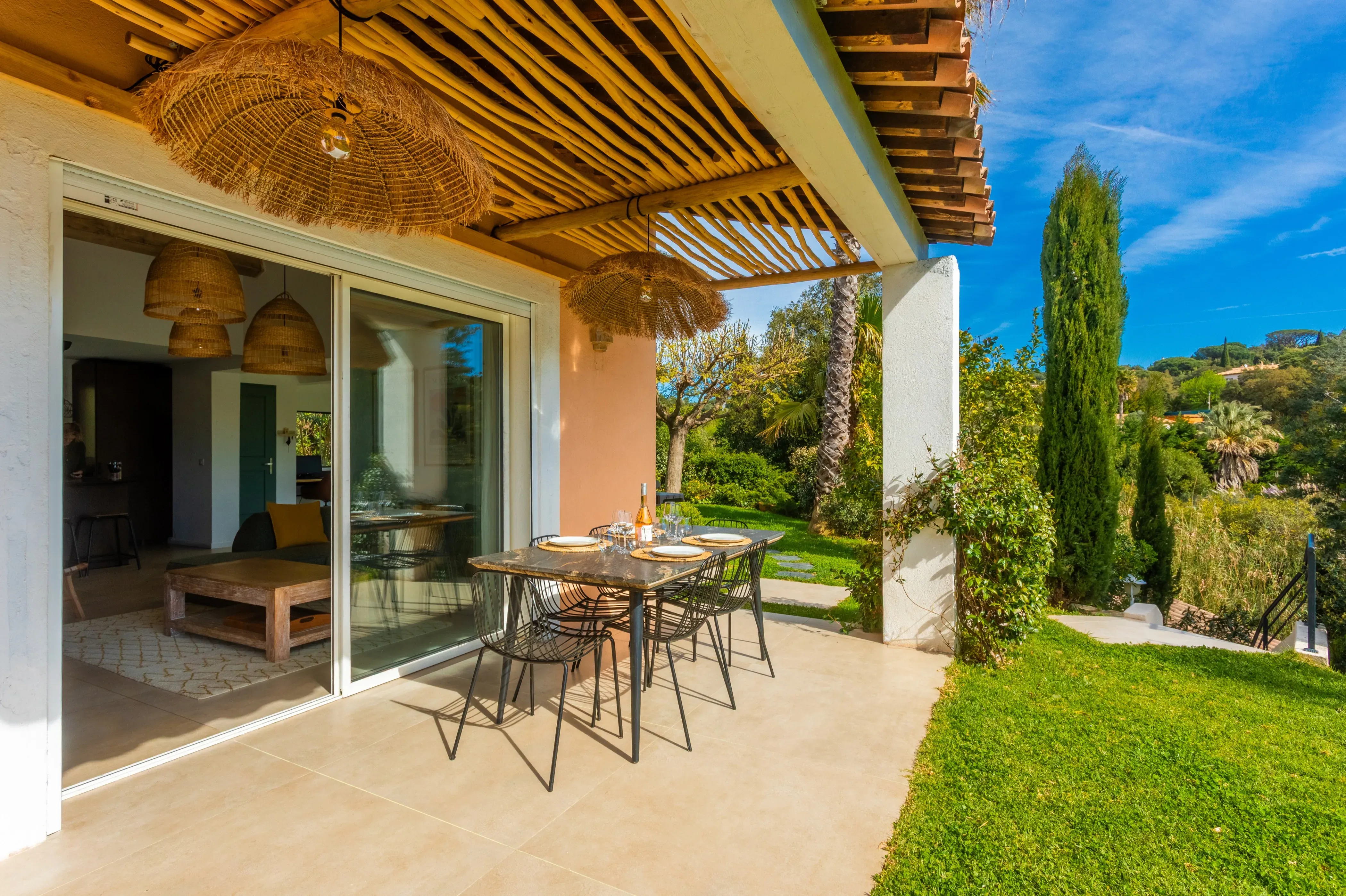 Terrace with sun loungers by the pool